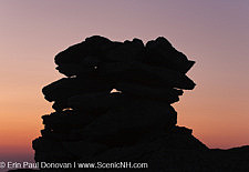 The silhouette of a rock cairn on the summit of Mount Washington at dusk in the White Mountains, New Hampshire USA