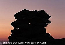 The silhouette of a rock cairn on the summit of Mount Washington at dusk in the White Mountains, New Hampshire USA
