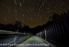 Star trails along the Kancamagus Scenic Byway (Route 112) in Lincoln, New Hampshire USA during the summer months